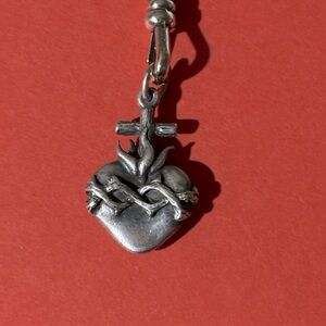 Rare retired sacred heart charm
Like new